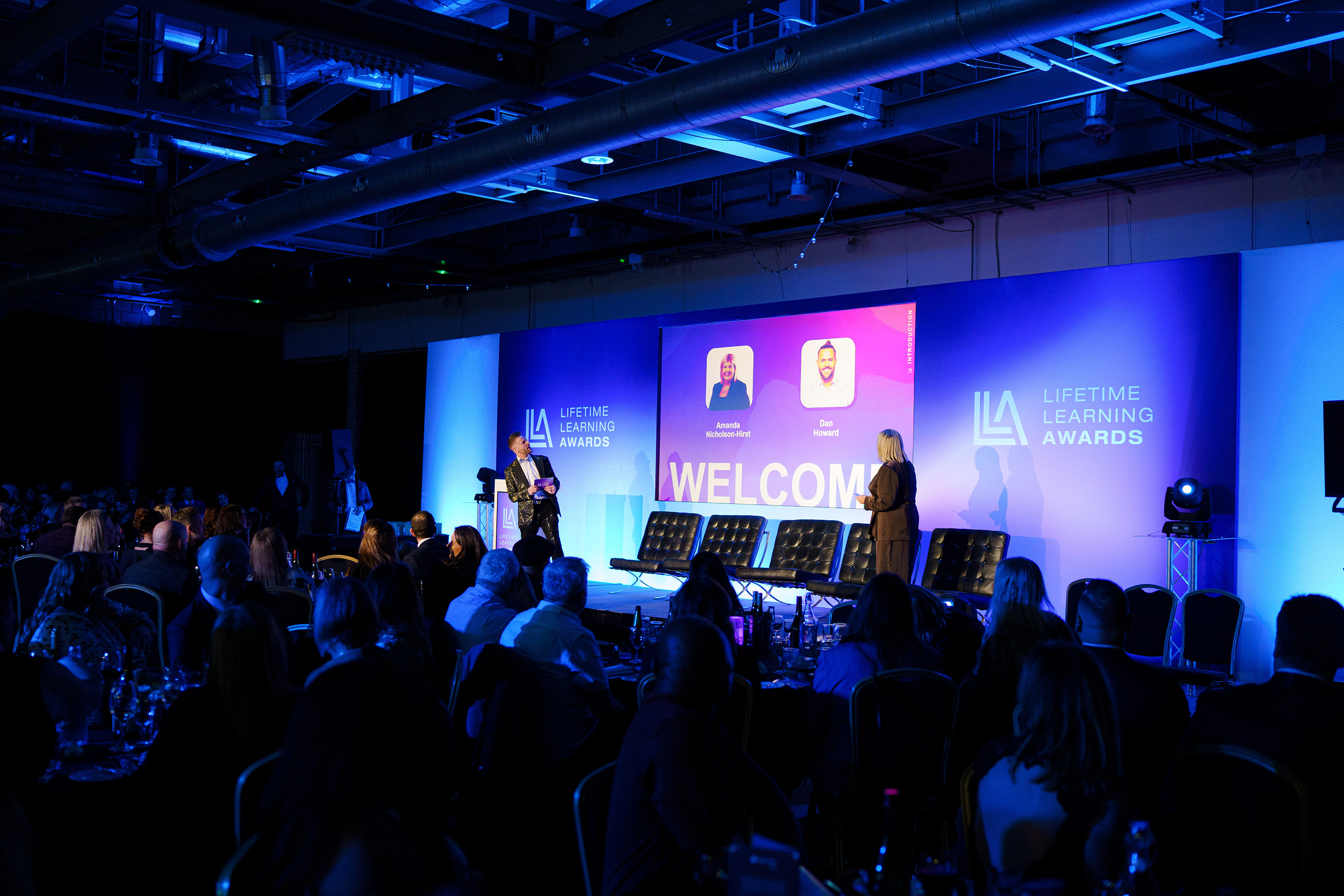 Lifetime Learning Awards 2026 — hosts on stage
